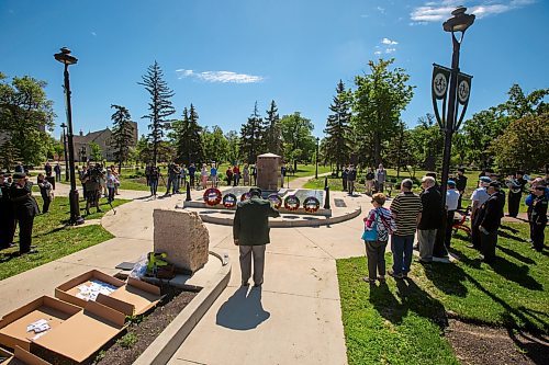 BROOK JONES / FREE PRESS
The Royal Winnipeg Rifles Association host an 80th D-Day anniversary ceremony at Vimy Ridge Park in Winnipeg, Man., Saturday, June 8, 2024. Pictured: People stand in silence as a member of the Royal Winnipeg Rifles Regimental Band plays the Last Post on a bugle during the commemoration ceremony.