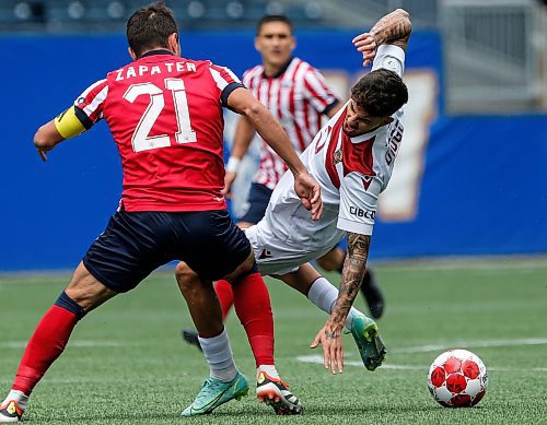 JOHN WOODS / FREE PRESS
Valour FC&#x2019;s Diogo Dias da Ressurrei&#xe7;&#xe3;o (20) is fouled by Atl&#xe9;tico Ottawa&#x2019;s Alberto Zapater Arjol (21) during first half CPL action in Winnipeg Sunday, June 9, 2024. 

Reporter: ?