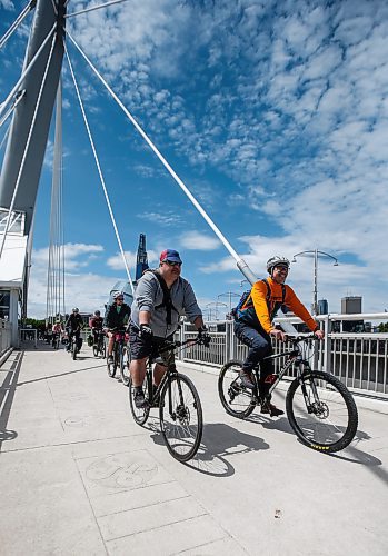 JOHN WOODS / FREE PRESS
Adrian Alphonso, right, leads Bezhig Miigwan reconciliation bike ride from the CMHR to the National Centre for Truth and Reconciliation in Winnipeg Sunday, June 9, 2024. 

Reporter: ?