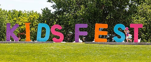 JOHN WOODS / FREE PRESS
A child plays around a sign during Kids Fest at the Forks in Winnipeg Sunday, June 9, 2024. 

Reporter: ?