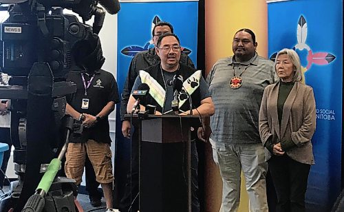 KATIE MAY / FREE PRESS

Black River Chief Sheldon Kent, backed by members of the Turtle Team, speaks at a news conference at AMC’s Portage Avenue office Monday. 