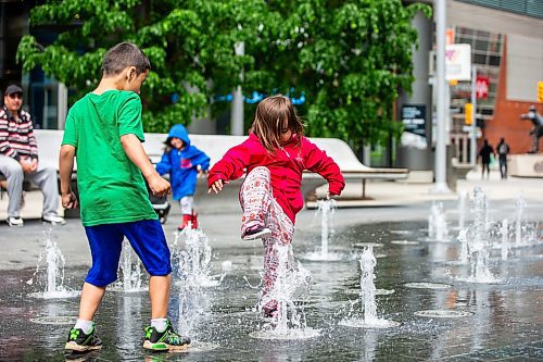 MIKAELA MACKENZIE / FREE PRESS

Three-year-old Jaylynn (no last name given) raises her foot to stomp on a stream of water with Maximus Iwaniw (six, left) at True North Square on Monday, June 10, 2024.

Standup.

