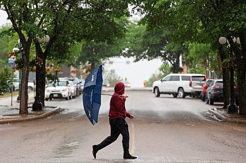 10062024
A pedestrian crosses Tenth Street in Brandon on a rainy Monday. (Tim Smith/The Brandon Sun)