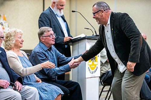 MIKAELA MACKENZIE / FREE PRESS

Manitoba Hockey Hall of Fame 2024 inductees Harvey Bolton (left) and Kelly Moore shake hands at the ceremony on Tuesday, June 11, 2024.

For Sawatzky story.

