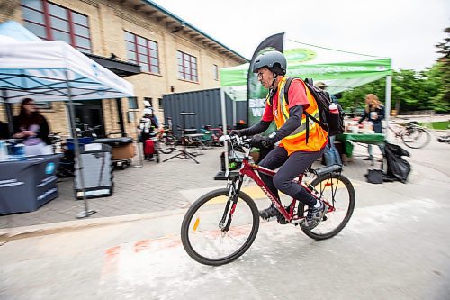 MIKAELA MACKENZIE / FREE PRESS

Dean Scaletta cycles away from the MPI all-day bike to work day pit stop at The Forks on Tuesday, June 11, 2024.

Standup.

