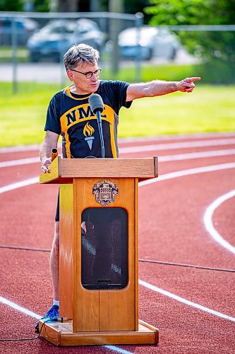 NIC ADAM / FREE PRESS

Coun. Brian Mayes speaks at a podium on the newly opened 200m outdoor rubberized track at Nelson McIntyre Collegiate Tuesday afternoon.

240611 - Tuesday, June 11, 2024.

Reporter: n/a