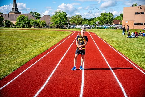 NIC ADAM / FREE PRESS

Coun. Brian Mayes poses for a photo on the newly opened 200m outdoor rubberized track at Nelson McIntyre Collegiate Tuesday afternoon.

240611 - Tuesday, June 11, 2024.

Reporter: n/a