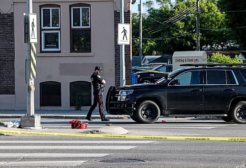 JOHN WOODS / FREE PRESS
Police attend a scene at a crosswalk on Notre Dame in Winnipeg Tuesday, June 11, 2024.  

Reporter: ?