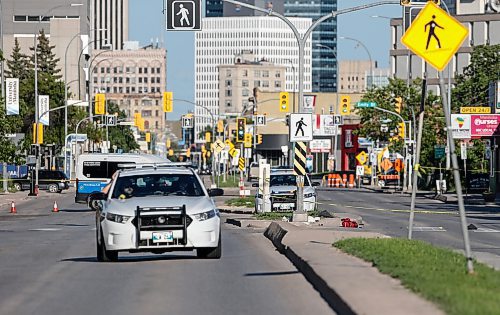 JOHN WOODS / FREE PRESS
Police attend a scene at a crosswalk on Notre Dame in Winnipeg Tuesday, June 11, 2024.  

Reporter: ?