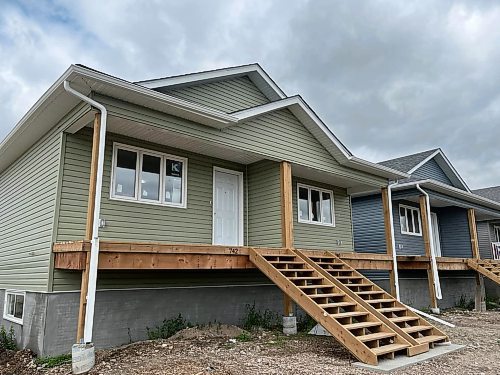 A Habitat for Humanity Brandon duplex under construction on Franklin Street in the city's east end. It's expected that the two families — one with three children and the other with five children — will be able to move in sometime in August. (Michele McDougall/The Brandon Sun)