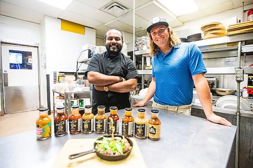 MIKAELA MACKENZIE / FREE PRESS

Ergin Gooriah (left) and Connor Ward, co-owners of Westside Premium Craft Sauce, in the kitchen at Howard Johnson's in St. James on Wednesday, June 12, 2024. Westside is a line of local craft sauces that is now being sold coast to coast, and is about to make inroads south of the border. 

For Dave Sanderson story.

