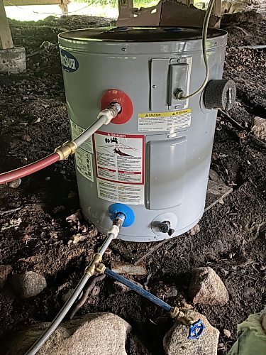 MAIN NEW
Photos by Marc LaBossiere / Free Press
The new 17-gallon SpaceSaver brand electric hot-water tank provides nearly double the hot water volume of the old tank, with the same electrical and water tie-ins for an easy installation.