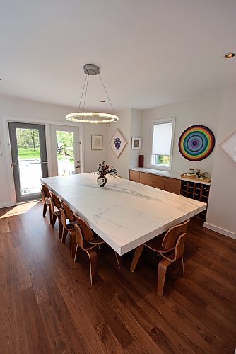 Todd Lewys / Free Press
A marble-style table that seats 10 pops on gorgeous walnut hardwoods, which also run through the adjacent family room.