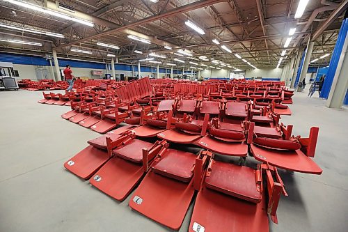 Hundreds of arena chairs that have been removed from Westoba Place lie on a cement floor inside the Keystone Centre. The chairs, which generally come in blocks of five, are available to the public as part of the facility's newly introduced Walk-In Wednesdays. Every Wednesday until the end of July or while quantities last, those interested can stop by and purchase seats between 1 p.m. and 6 p.m. Seats are sold at $1 per seat, cash only. (Matt Goerzen/The Brandon Sun)