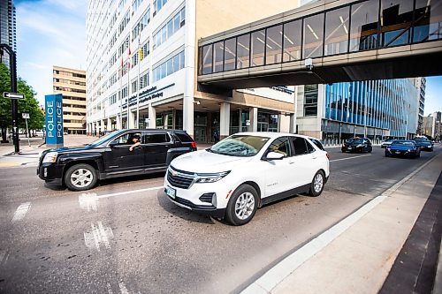 MIKAELA MACKENZIE / FREE PRESS

Cars pass by the police headquarters, where an attempted carjacking occurred yesterday, on Smith Street on Wednesday, June 12, 2024.

For &#x2014; story.

