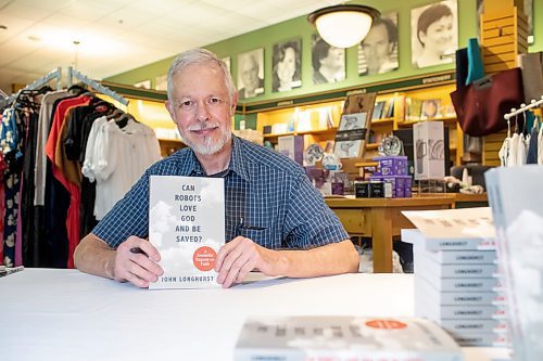 BROOK JONES / FREE PRESS
Free Press faith reporter John Longhurst launches his book Can Robots Love God and Be Saved? A Journalist Reports on Faith published by CMU Press. The event at McNally Robinson in Winnipeg, Man., Wednesday, June 12, 2024 was hosted by Rev. Michael Wilson of Charleswood United Church and featured guests Free Press Editor Paul Samyn, and Christine Baronins, who is the director of public affairs with the Church of Jesus Christ of Latter-day Saints in Manitoba and a member of the Manitoba Multifaith Council executive. Pictured: Longhurst with a copy of his book.