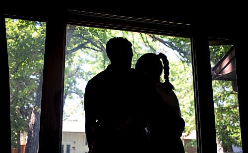 MIKAELA MACKENZIE / FREE PRESS

Parents of a child who had traumatic experiences at a daycare centre pose for a photo in their home on Wednesday, June 12, 2024.

For Jeff story.

