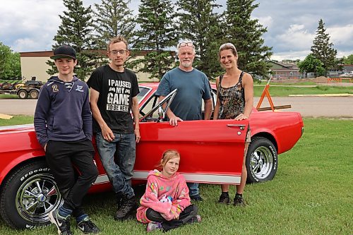 Layne Green, his wife, daughter and sons with his 1966 Mustang GT Custom. From left Ashton, Brenyn, Jalayna (seated on the grass), and Dianna Hysop. (Michele McDougall/The Brandon Sun) 