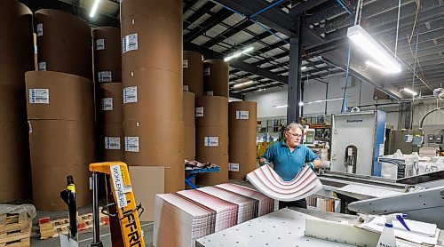 MIKE DEAL / FREE PRESS
Jack Sitar a Squaring Cutter at Duha Group works at his station while giant rolls of paper wait for the printing press. The fourth-generation family business makes colour swatches and other colour marketing tools located at 750 Bradford Street.
See Aaron App story
240613 - Thursday, June 13, 2024.