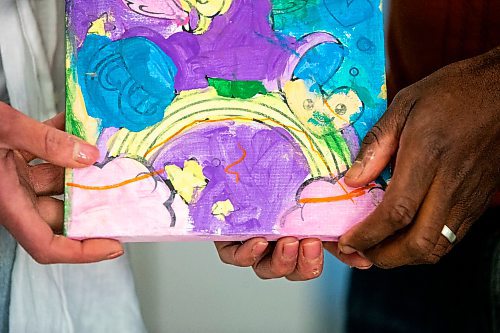 MIKAELA MACKENZIE / FREE PRESS

Parents of a child who had traumatic experiences at a daycare centre pose for a photo with one of their daughter&#x573; art pieces in their home on Wednesday, June 12, 2024.

For Jeff story.

