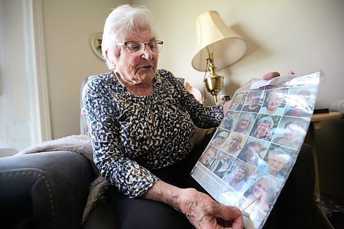 Josephine &quot;Jo&quot; Stokotelny, seen here her apartment at Loray Manor in Dauphin, holds up a copy of the Winnipeg Free Press from 2023 showing the photos of most of the individuals who died as a result of the June 15, 2023 collision near Carberry that claimed the lives of 17 people from the city of Dauphin. Stokotelny says she prays for them every day. (Matt Goerzen/The Brandon Sun)