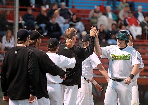 Brandon Cloverleafs catcher Bryan Swaenepoel smiles as he crosses over home plate where he was meet by teammates following his home-run hit late in a Manitoba Senior Baseball League game against Reston at Andrews Field. (Brandon Sun file photo)