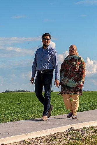 BROOK JONES / FREE PRESS
Danish Habib (left) and his wife Urooj Danish who are both Muslim are pictured walking around their neighbourhood in La Salle, Man., Thursday, June 13, 2024. The couple participated in a Hajj pilgrimage to Makkah, Saudi Arabia in 2017.