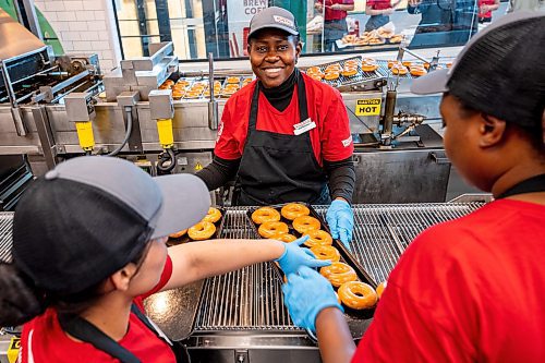 NIC ADAM / FREE PRESS
Krispy Kreme had the grand opening of its first Winnipeg location on the corner of Sterling Lyon Pkwy. and Kenaston Blvd. Thursday afternoon.
Workers make original glazed doughnuts, a Krispy Kreme staple, for grand opening attendees.
240613 - Thursday, June 13, 2024.

Reporter: Eva Wasney
