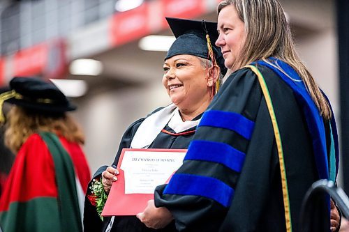 MIKAELA MACKENZIE / FREE PRESS

U of W&#x573; Developmental Studies program graduate Twyla McKay poses for a photo with dean of education Laurie-Ann Hellsten while crossing the stage on Friday, June 14, 2024. 

For Jura story.

