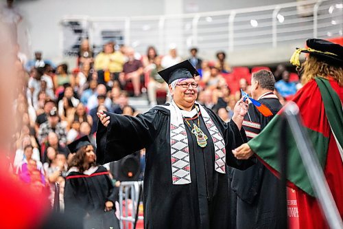 MIKAELA MACKENZIE / FREE PRESS

U of W&#x573; Developmental Studies program graduate Vivian Scott reaches to embrace program director Sheri-Lynn Skwarchuk while crossing the stage on Friday, June 14, 2024. 

For Jura story.

