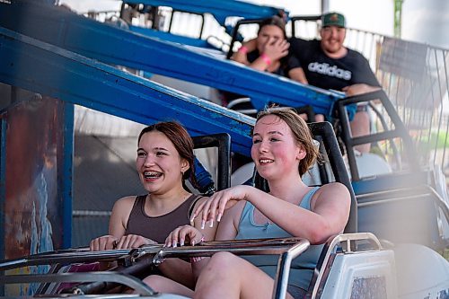 NIC ADAM / FREE PRESS
Red River Ex opened for the season Friday afternoon. The RRE is an annual carnival held at the Assiniboia Downs.
Danilea Grzdoeniale (left), and Lyra Budden, enjoy a ride on the Alpine Bobs at the Red River Ex
240614 - Friday, June 14, 2024.

Reporter: ?