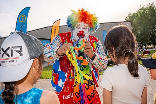 NIC ADAM / FREE PRESS
Red River Ex opened for the season Friday afternoon. The RRE is an annual carnival held at the Assiniboia Downs.
Doo Doo the Clown, and his son Aaron Matthews, pose for a photo at the Red River Ex. Doo Doo said that this was a special gig because The Red River Ex is his favourite place to perform and that he got to perform at the same place as his son for Fathers Day.
240614 - Friday, June 14, 2024.

Reporter: ?
