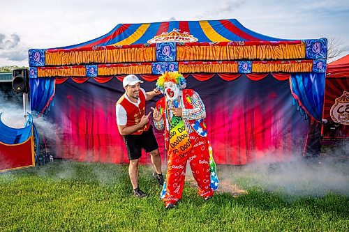 NIC ADAM / FREE PRESS
Red River Ex opened for the season Friday afternoon. The RRE is an annual carnival held at the Assiniboia Downs.
Doo Doo the Clown, and his son Aaron Matthews, pose for a photo at the Red River Ex. Doo Doo said that this was a special gig because The Red River Ex is his favourite place to perform and that he got to perform at the same place as his son for Fathers Day.
240614 - Friday, June 14, 2024.

Reporter: ?
