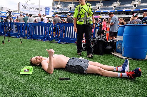 Mike Sudoma/Free Press
Runner Justin Rabb takes a minute to stretch out on the sidelines of the 46th annual Manitoba Marathon Sunday morning
June 15, 2024
