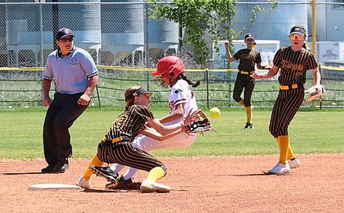 Westman Magic shortstop Georgia Koop (33) of Virden hauls in a throw from the plate on a successful stolen base attempt by Smitty's Terminators base runner Nyah Hrominchuk (77) of Winnipeg during under-13 Manitoba Premier Softball League action at Ashley Neufeld Softball Complex on Sunday. (Perry Bergson/The Brandon Sun)
June 17, 2024