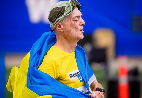 Mike Sudoma/Free Press
Manitoba Marathon participant, Thomas Gleichmann crosses the finish line of the full marathon wrapped in a Ukrainian flag Sunday morning
June 15, 2024
