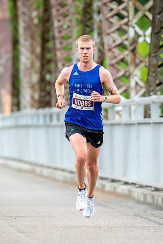 BROOK JONES / FREE PRESS
Thomas Nobbs crosses the BDI bridge as he competes in Half Marathon National Championships at the Manitoba Marathon in Winnipeg, Man., Sunday, June 16, 2024.