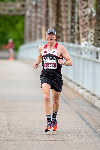 BROOK JONES / FREE PRESS
Winnipeg resident John Coffin is all smiles as he crosses the BDI bridge as he competes in Half Marathon National Championships at the Manitoba Marathon in Winnipeg, Man., Sunday, June 16, 2024.