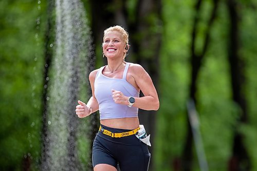 BROOK JONES / FREE PRESS
Full marathon participant Jenn Sacco is all smiles as she runs down Crescent Drive during the 46th running of the Manitoba Marathon in Winnipeg, Man., Sunday, June 18, 2023.