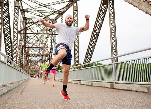 BROOK JONES / FREE PRESS
Dave Gagnon leaps in the air as he crosses the BDI bridge in the half marathon race at the 46th annual Manitoba Marathon in Winnipeg, Man., Sunday, June 16, 2024.