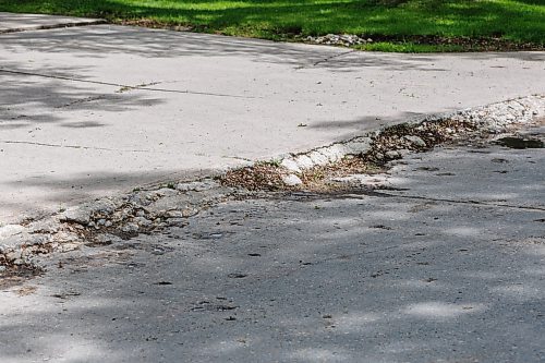 MIKE DEAL / FREE PRESS
The crumbling curb at the entrance to Greensboro Bay.
The condition of the streets in Waverley Heights. Specifically Augusta Drive and Greensboro Bay, showing potholes, crumbling curbs, cracks in the pavement.
240613 - Thursday, June 13, 2024.