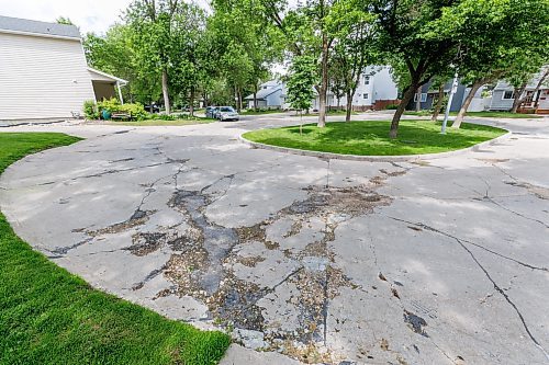 MIKE DEAL / FREE PRESS
Greensboro Bay
The condition of the streets in Waverley Heights. Specifically Augusta Drive and Greensboro Bay, showing potholes, crumbling curbs, cracks in the pavement.
240613 - Thursday, June 13, 2024.