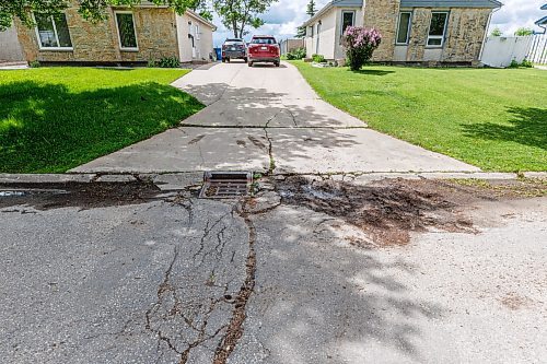 MIKE DEAL / FREE PRESS
Curb and water drainage along with road crumbling on Greensboro Square.
The condition of the streets in Waverley Heights. Specifically Augusta Drive and Greensboro Bay, showing potholes, crumbling curbs, cracks in the pavement.
240613 - Thursday, June 13, 2024.