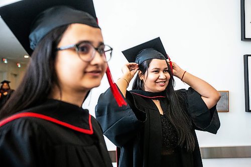 MIKAELA MACKENZIE / FREE PRESS

RRC Polytech applied accounting graduates Kanika Bansal (right) and Jaspreet Kaur Sidhu put their caps on before their graduatin ceremony at the RBC Convention Centre on Monday, June 17, 2024. 

For Matthew Frank story.

