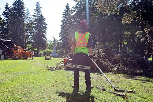 17062024
City of Brandon workers clean up a large tree that fell in the Brandon Cemetery during the high winds and storms that rolled through southwestern Manitoba throughout the weekend. 
(Tim Smith/The Brandon Sun)