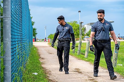 NIC ADAM / FREE PRESS
Following an incident at the Red River Ex over the weekend, security along its perimeter is increasing. 
Toro Security guards, Manpreet Singh (left) and Gurtaj Singh, check the perimeter of the RRE on Monday afternoon. They say that it&#x2019;s here along the fence, between the service and main entrances, that they find the most contraband; at least one or two items every time they pass by. 
240617 - Monday, June 17, 2024.

Reporter: Chris
