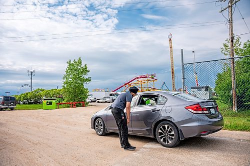 NIC ADAM / FREE PRESS
Following an incident at the Red River Ex over the weekend, security along its perimeter is increasing. 
Toro Security guard, Amritpal Singh, checks vehicles as they enter through the service entrance of the fair grounds on Monday afternoon.
240617 - Monday, June 17, 2024.

Reporter: Chris
