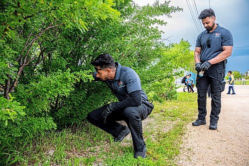 NIC ADAM / FREE PRESS
Following an incident at the Red River Ex over the weekend, security along its perimeter is increasing. 
Toro Security guards, Manpreet Singh (left) and Gurtaj Singh, check the perimeter of the RRE on Monday afternoon. They say that it&#x2019;s here along the fence, between the service and main entrances, that they find the most contraband; at least one or two items every time they pass by. 
240617 - Monday, June 17, 2024.

Reporter: Chris
