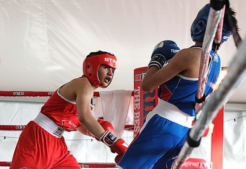 Ray (Sugar Ray) Abdo of Saskatoon knocks opponent Koby Chartrand onto the ropes during the Peak Boxing Event in a tent at the Riverbank Discovery Centre Saturday night. The five-hour show featured 25 bouts. Abdo emerged with a victory during his three-round bout. (Perry Bergson/The Brandon Sun)
 