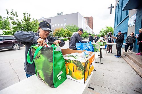 MIKAELA MACKENZIE / FREE PRESS

Joanne Nimik packs up her food bank box at Agape Table on Furby Street on Tuesday, June 18, 2024. The organization is currently experiencing an unprecedented increase in requests for food assistance, and is putting out the call for more donations to support the need.

For Jura story.

